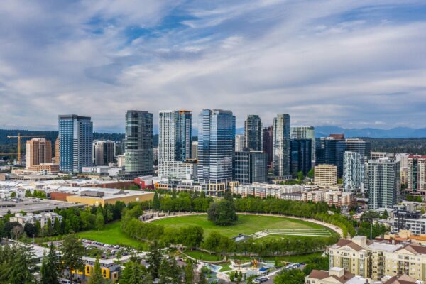 Aerial view of Bellevue skyline with diverse architectural styles, showcasing investment opportunities in high-rise condos and waterfront properties.